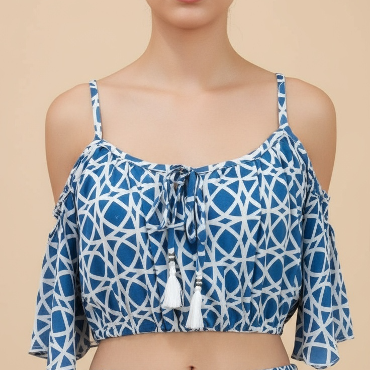 Blue and white patterned top and pants set on a beige background